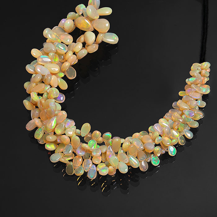 manufacturer of Ethiopian Opal Plain Beads Strands for jewellery